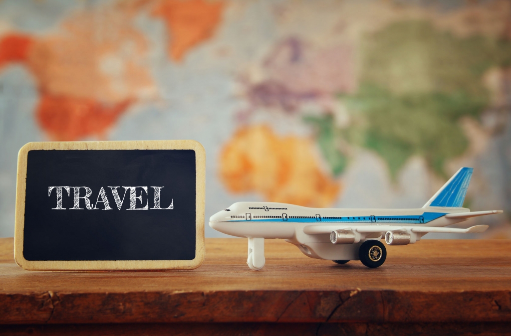 55591971 - airplane toy next to blackboard. vintage filtered image. selective focus